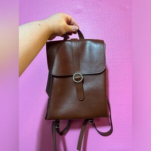 Small leather brown backpack for everyday use